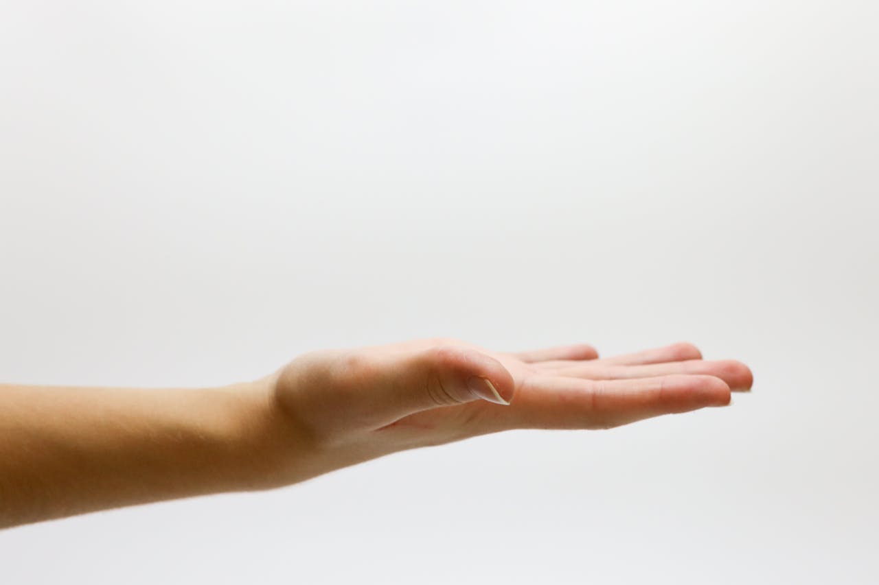 hero-img-01 Detailed close-up of an open human hand on a white background, emphasizing gestures and expressions.